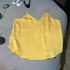 Gold or mustard yellow lines express spaghetti top blouse